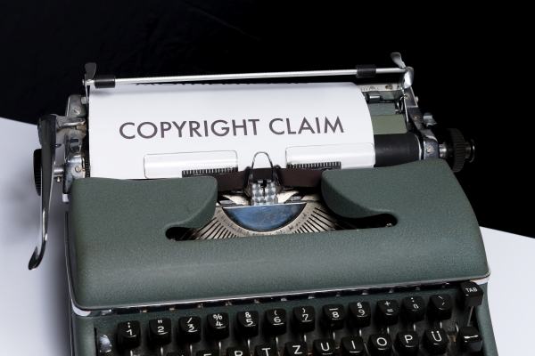 typerwriter showing "copyright claim" on paper
